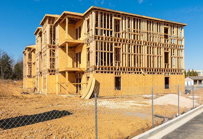 a close-up of temporary chain link fences enclosing a job site, signaling progress in the project's development in Mosheim